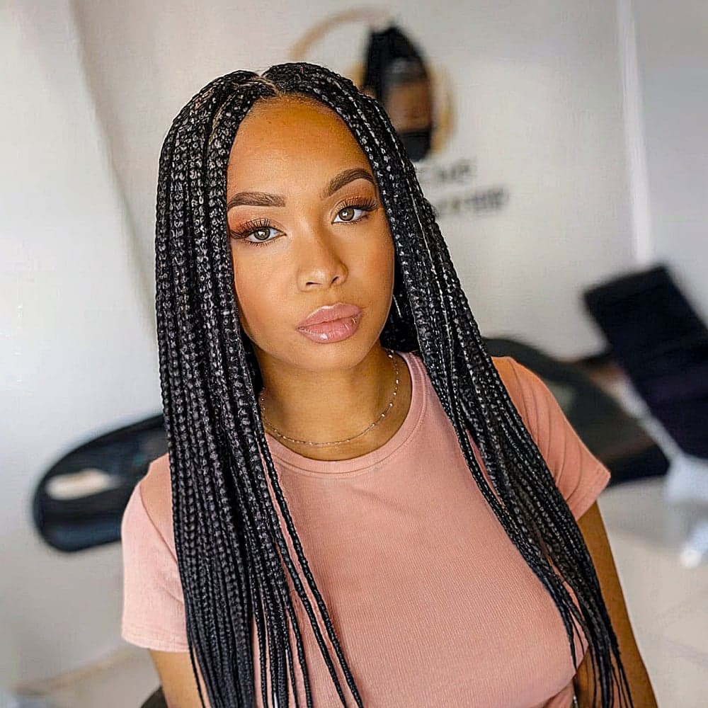 A Stunning Braids Featuring A Center Part